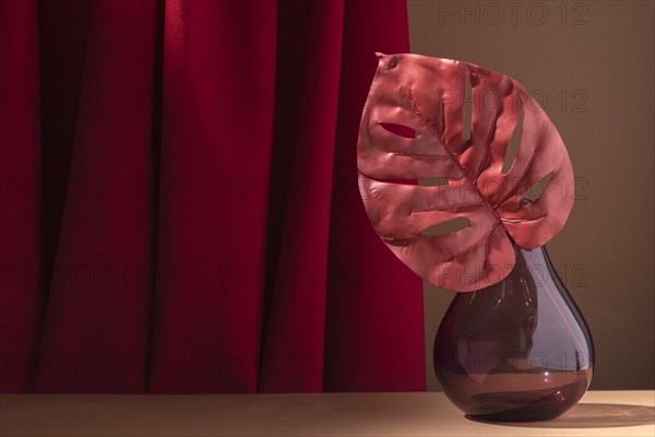 Arrangement with pink monstera plant vase