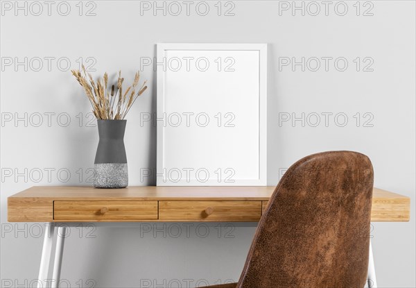 Frame mock up table beside vase