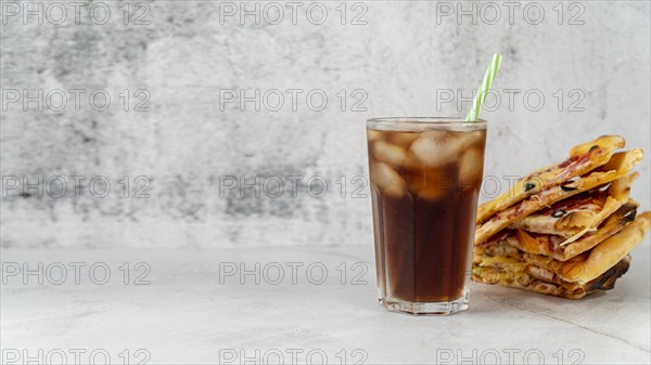 Front view pizza slices with soda