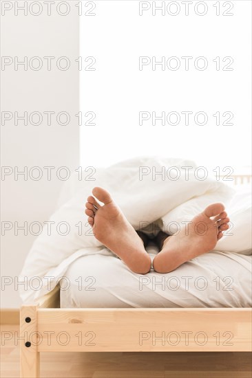 Person s feet blanket