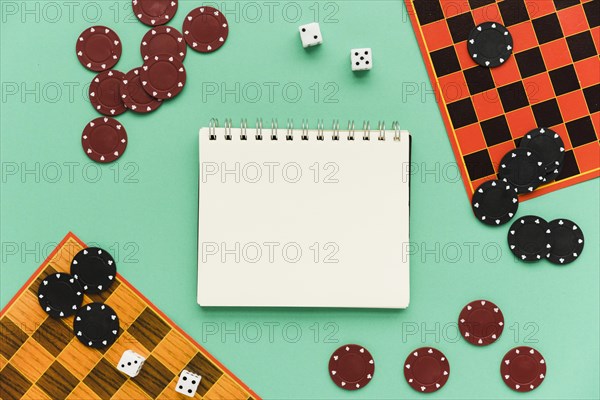 Top view society games with mock up notepad
