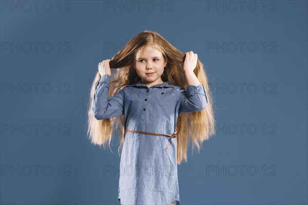 Cute girl touching hair