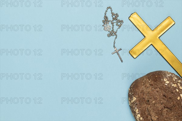 Copy space holy cross necklace with bread