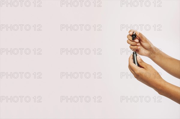 Hands with eyelashes brush