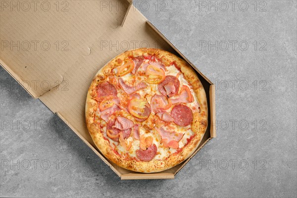 Top view of pizza with ham