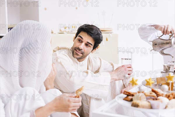 Eid concept with group friends eating