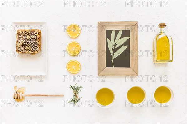 Twig wooden frame with oil ingredients honeycomb