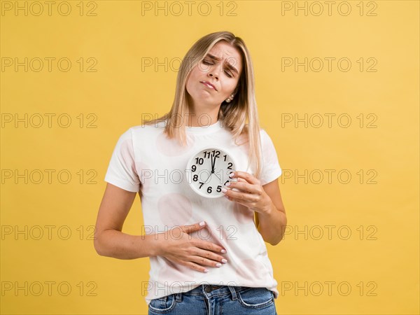 Woman with stomachache clock