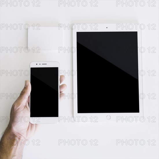 Mockup with hand holding smartphone tablet