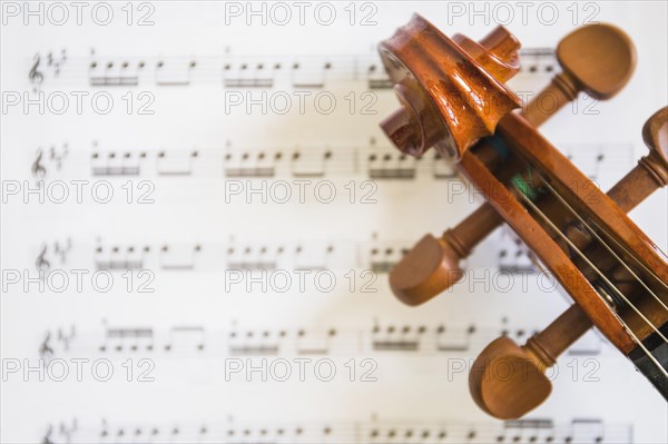 Overhead view violin scroll strings musical notes