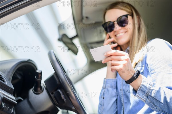 Portrait smiley woman giving card details