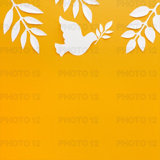 Top view paper dove with copy space paper leaves