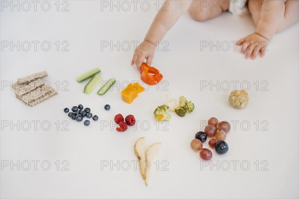 Baby choosing what eat alone