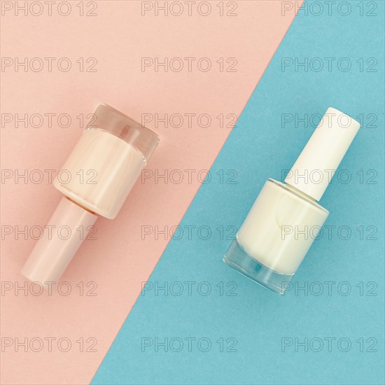 Nail polish blue pink background