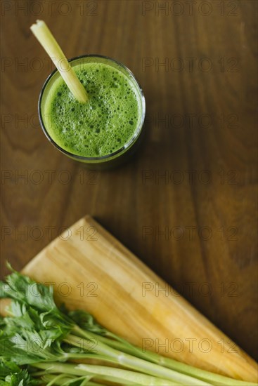Elevated view fresh green smoothie wooden desk