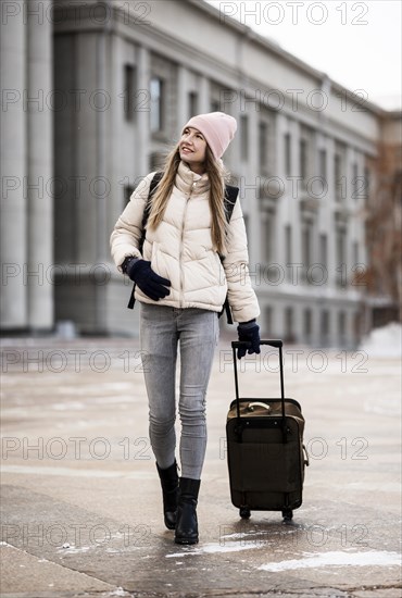 Portrait female student with luggage