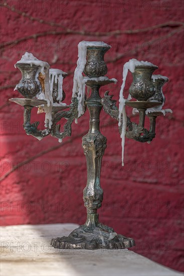 Five-armed candlestick with candle wax remains