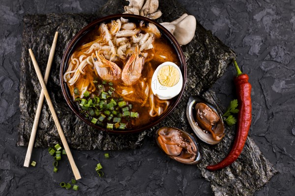 Top view ramen dish with shrimps oysters