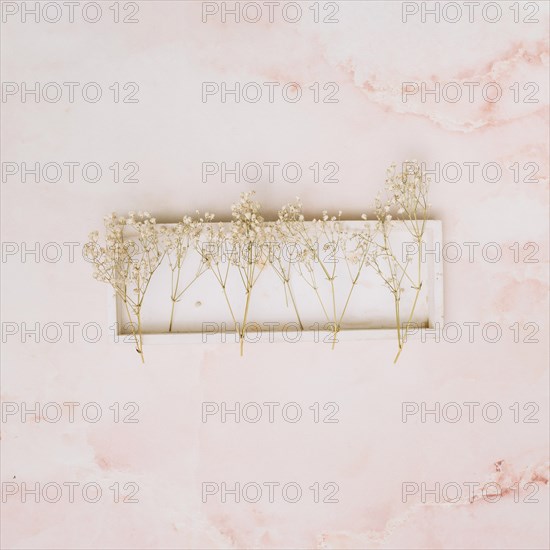 Small flowers branches wooden board table