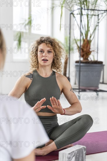 Yoga teacher explaining