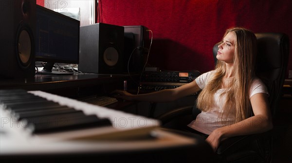 Close up keyboard blurred woman studio