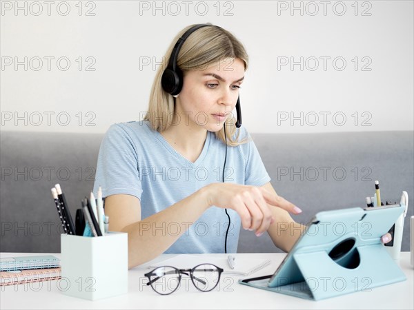 Female student using digital tablet