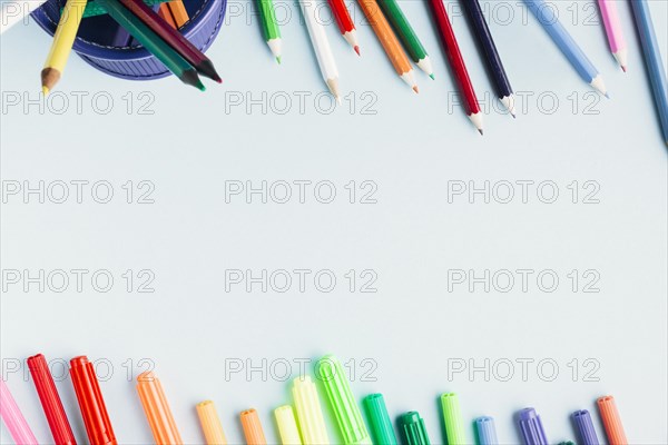 Bright markers pencils white background