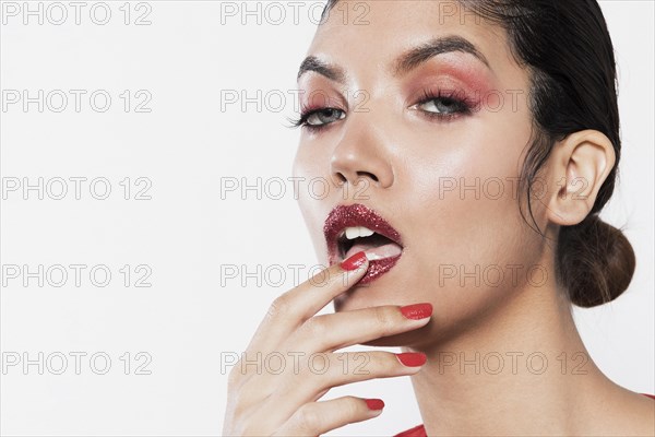 Close up shot model touching dark lips