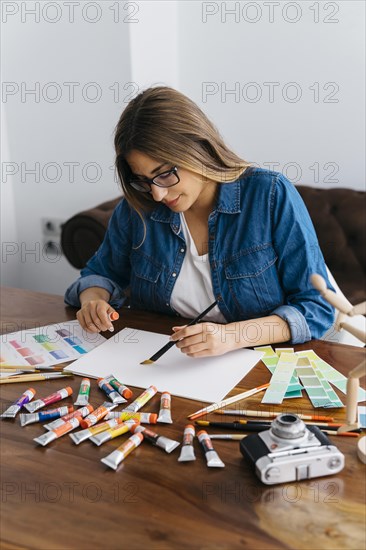 Female artist painting desk