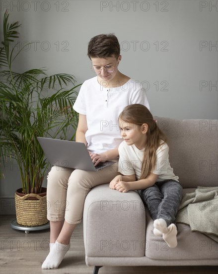 Kid parent looking laptop