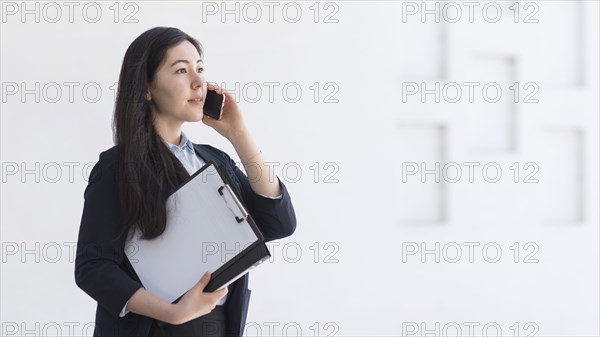 Side view woman with smartphone