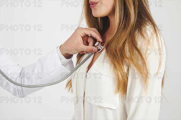 Doctor using stethoscope