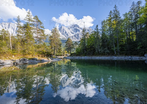 Zugspitze massif and Zugspitze reflected in Eibsee lake