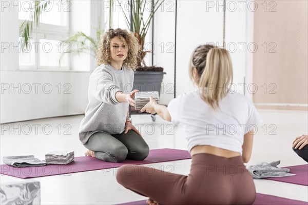 Full shot women yoga class