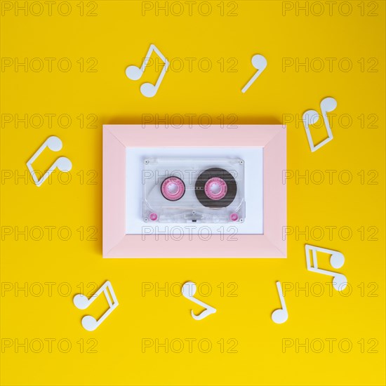 Bright colorful cassette tape with musical notes around it