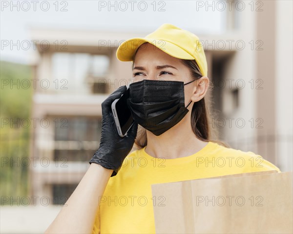 Delivery woman talking phone