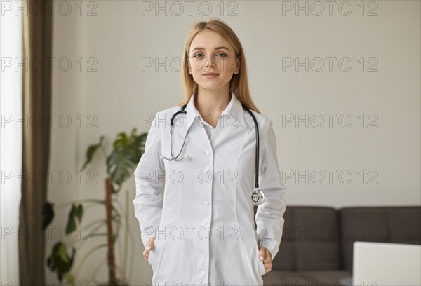 Front view covid recovery center female doctor with posing with stethoscope