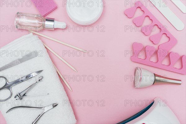 Nail care accessory tools copy space pink background