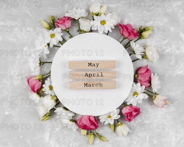 Top view beautiful spring flowers composition with round card