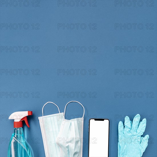 Top view medical mask gloves with blank phone