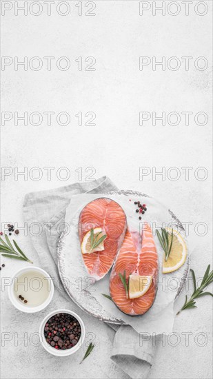 Top view slices salmon with lemon