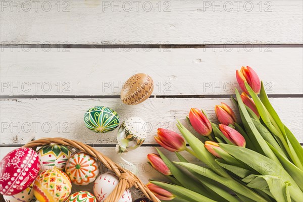 Eggs basket near tulips