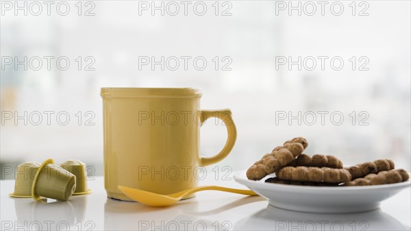Teacup with biscuits