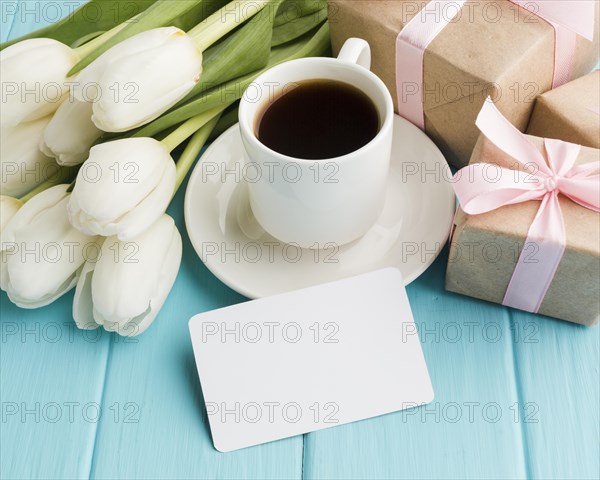 High view bouquet tulip flowers with morning coffee