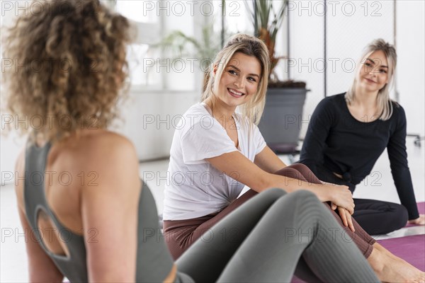 Women sitting mats