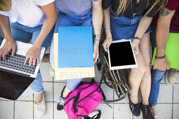 Crop students studying pavement