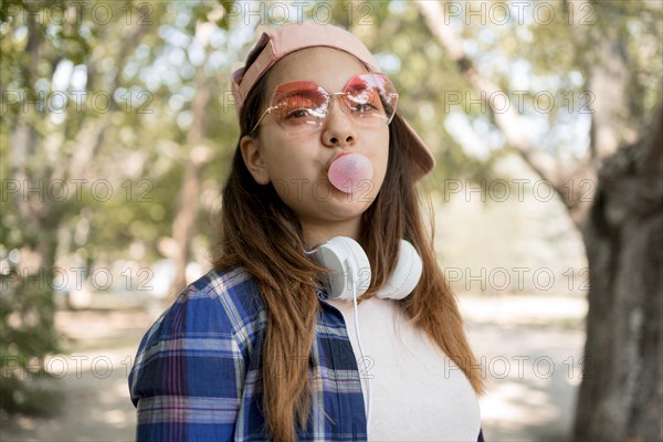 Girl making bubble gum