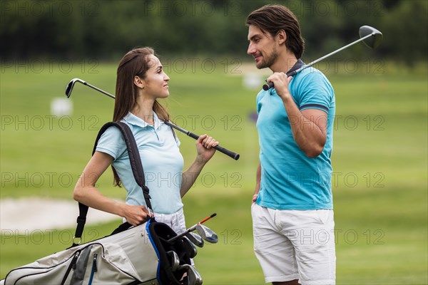 Front view fit friends playing golf