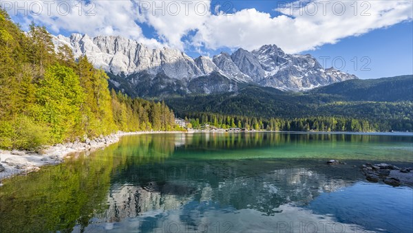 Zugspitze massif and Zugspitze reflected in Eibsee lake