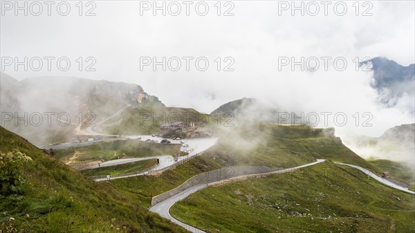 Morning fog drifts over a mountain ridge